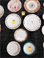 (4) China Plates and (3) Saucers Consisting of