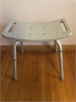 ADJUSTABLE SHOWER SEAT.  THIS IS A STATIONARY SEAT