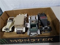 Four model cars some are from Franklin Mint