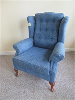 A Queen Anne Style Upholstered Wingback Chair