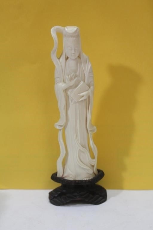 A Carved Bone Figurine