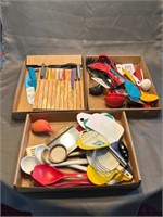 Three boxes of kitchen utensils