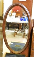 Oak Framed Oval Beveled Mirror.