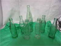7 Coca-Cola Bottles