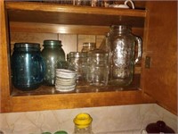 Group of mason jars including a blue quart