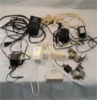 Assorted AC adapters and electrical plugs