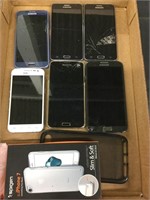 Six Samsung cell phones and two cases, as is