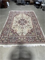 8 x 11 foot area rug. Rug shows some wear and