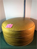 Gold colored round footstool