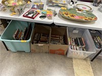 ALL OF THE PAPERBACK BOOKS UNDER THIS TABLE