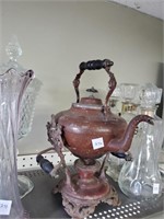 Vintage tilting tea pot on stand