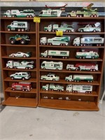 2 PRESSED WOOD STORAGE CABINETS FULL OF HESS