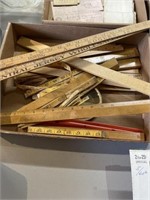 Box of vintage rulers