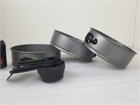 Three Springform Pans and Measuring Cups