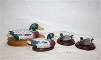 Wooden and Resin Ducks on wooden platforms
