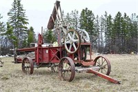 EARLY TRACTOR POWERED HAY PRESS