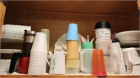 Cups, plasticware, contents of cabinet