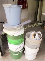 Stack of buckets, mostly 5 gallon size