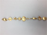 14 karat gold seashell bracelet;