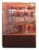 Display Case Full of Coca Cola Collectibles