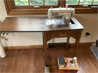 Sears Kenmore sewing machine in cabinet.  Heavy.