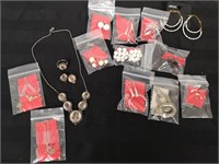 Costume jewelry necklaces, earrings, and a ring