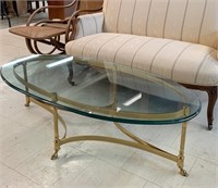 Brass and Heavy Glass Rolling Coffee Table