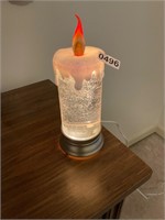 Lighted snow candle decor