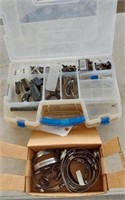 CLAMPS AND MACHINE PARTS IN A PLASTIC ORGANIZER