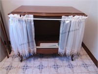 Old TV console converted into cabinet