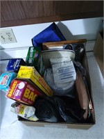 Box lot of paper products, garbage bags trivet