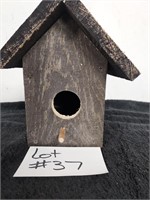 Handmade birdhouse lid opens up for easy access