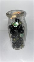 Pt milk bottle w/ marbles