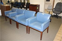 Four blue leather waiting room chairs