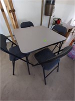 Folding table and 4 padded chairs