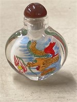 Reverse painted snuff bottle using a single hair