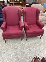 2 red high back chairs