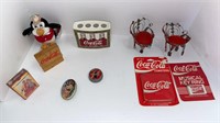 Coca-Cola items (coasters, keychain, cards,