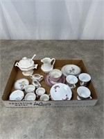 Small porcelain doll tea cups and saucers, sugar