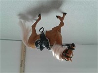 Plastic toy horse with saddle