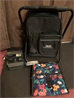 Folding chair, lunch bag, Polaroid