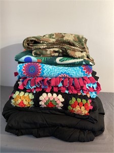Assorted afghans and blankets