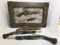 Framed pair of olde pistol replicas on ancient