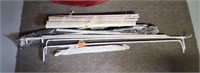 Assorted curtain rods and blinds