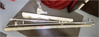 Assorted curtain rods and curtain panel.