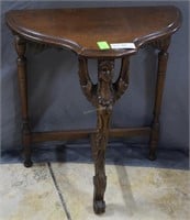 Tri-leg table with carved bust of woman