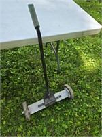 Magnetic floor sweeper with release
