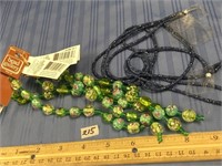 Lot with four glass bead strands and two blue bead