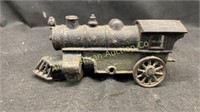 Antique cast iron locomotive, missing an axle