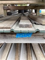 Approximately 25 sheets of metal siding, various